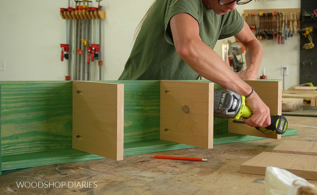 Shara Woodshop Diaries attaching shelves to divider using pocket holes and screws