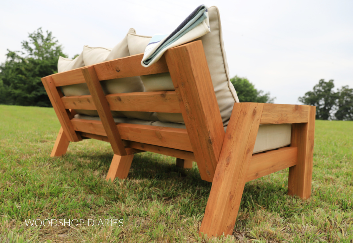 Back side view of finished DIY outdoor couch with 3 sets of cushions for seat and back