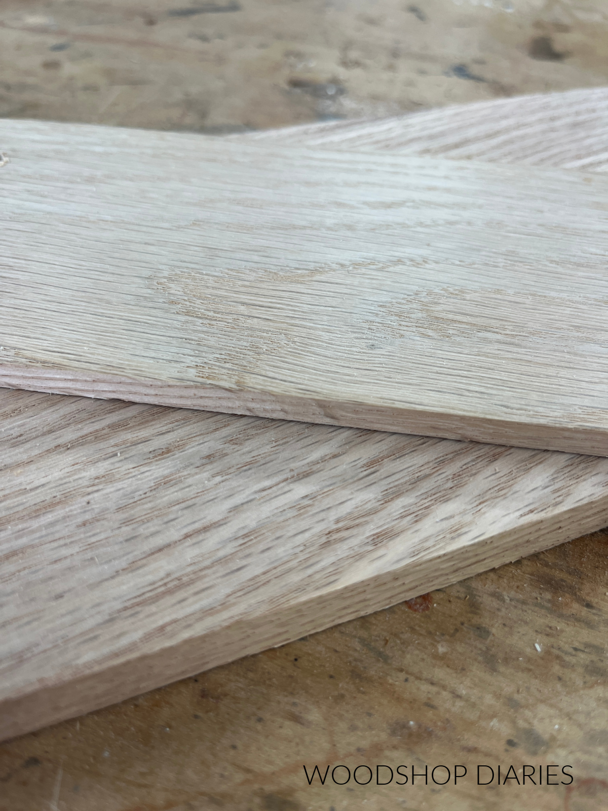 Close up of ¼" and ½" thick solid oak scraps on workbench