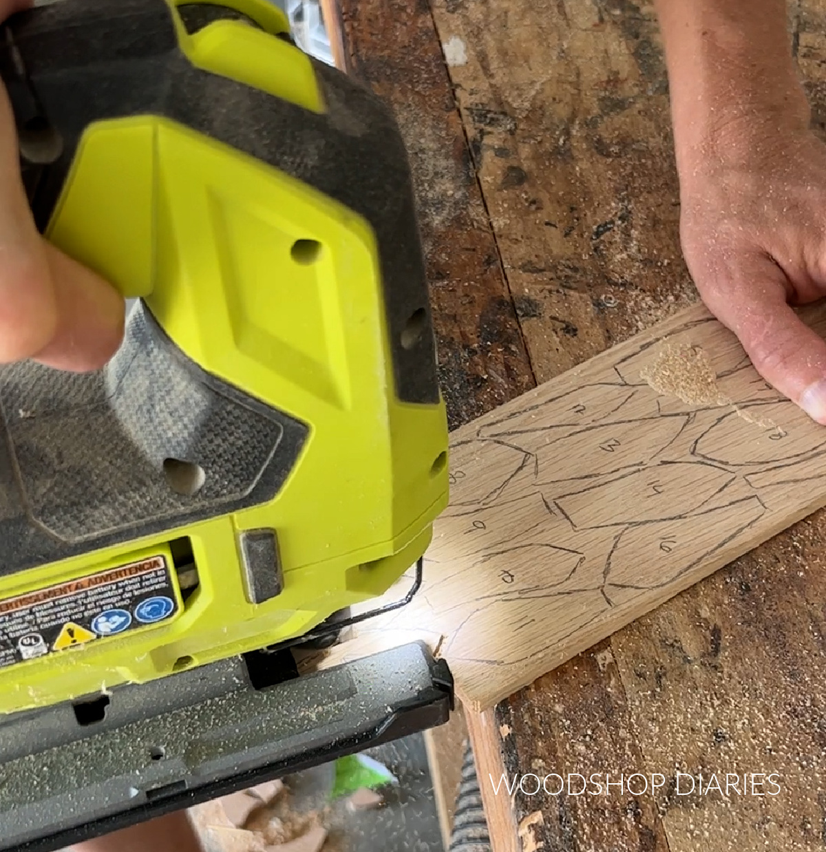 Close up of jig saw cutting sunflower petals out of oak scraps