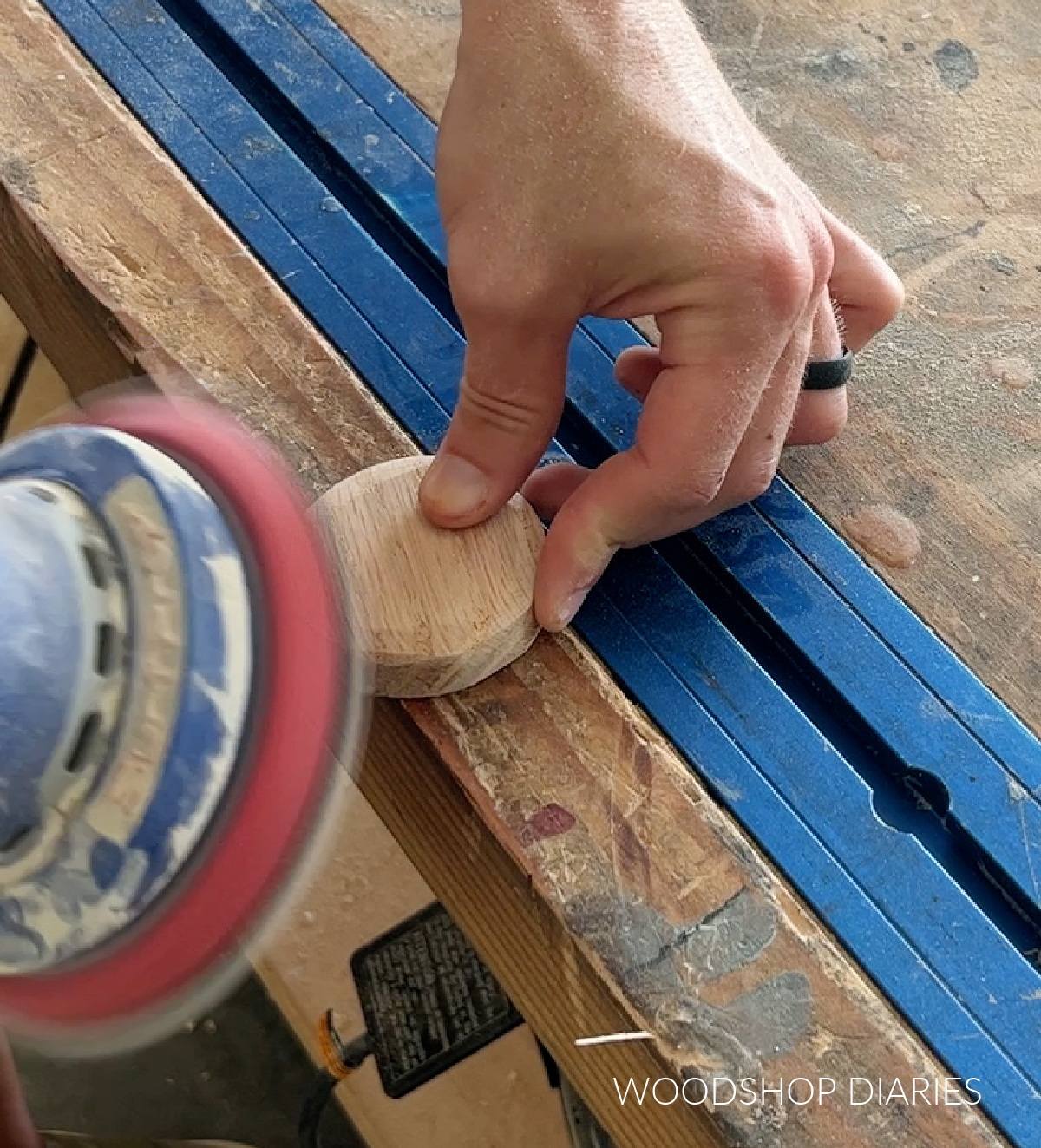 Close up of sanding wooden flower center piece