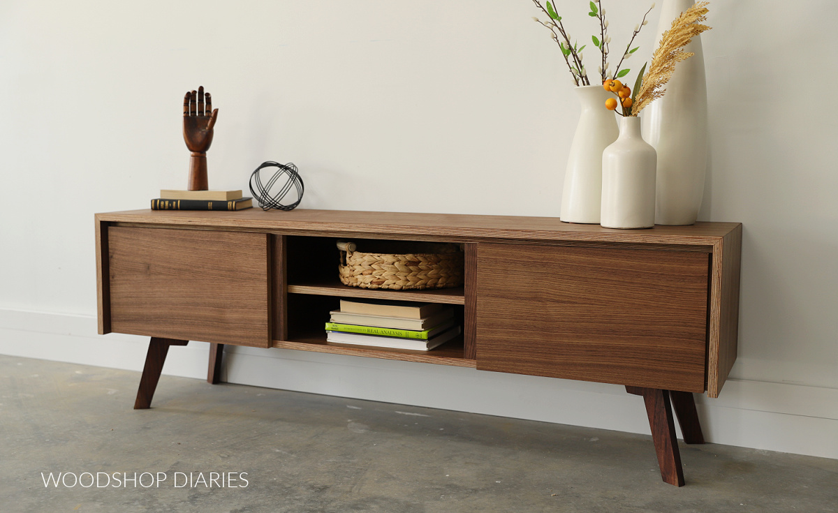 Mid century style modern walnut console cabinet with legs and center shelving
