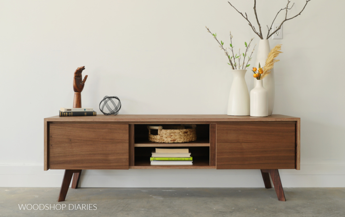 Modern walnut console cabinet with legs