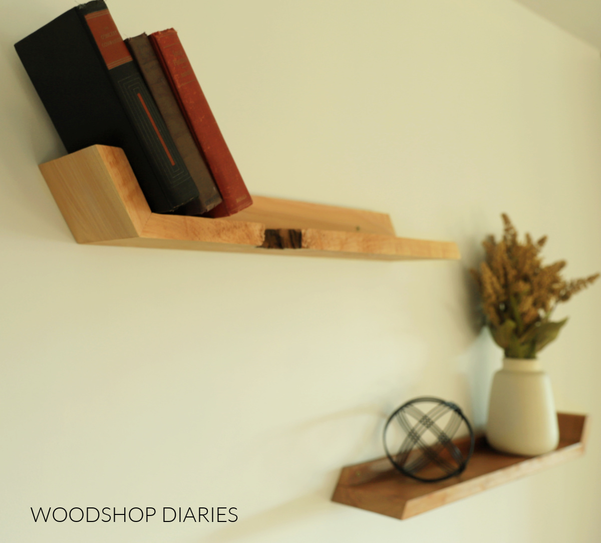 Cypress and cherry wood floating shelves hung on white wall 