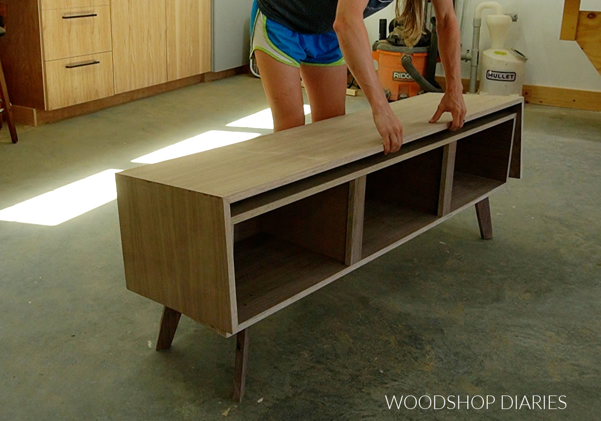 Shara Woodshop Diaries placing outside box on inside box to assemble console cabinet