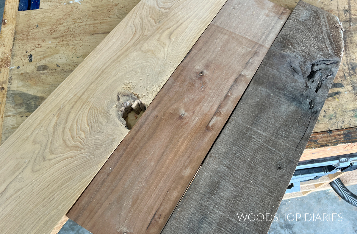 Cypress, cherry, walnut boards laying side by side on workbench