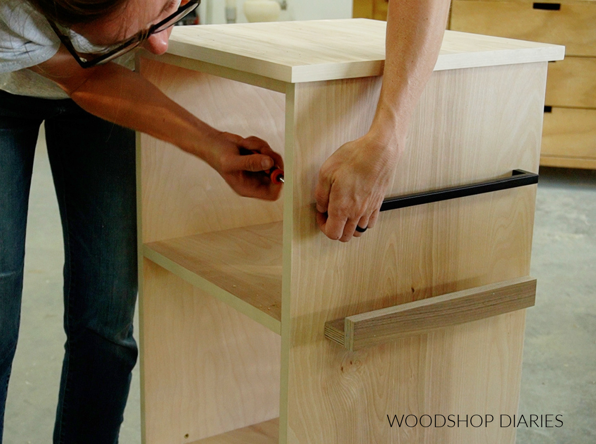 Shara Woodshop Diaries installing drawer pulls on side of rotating bookshelf