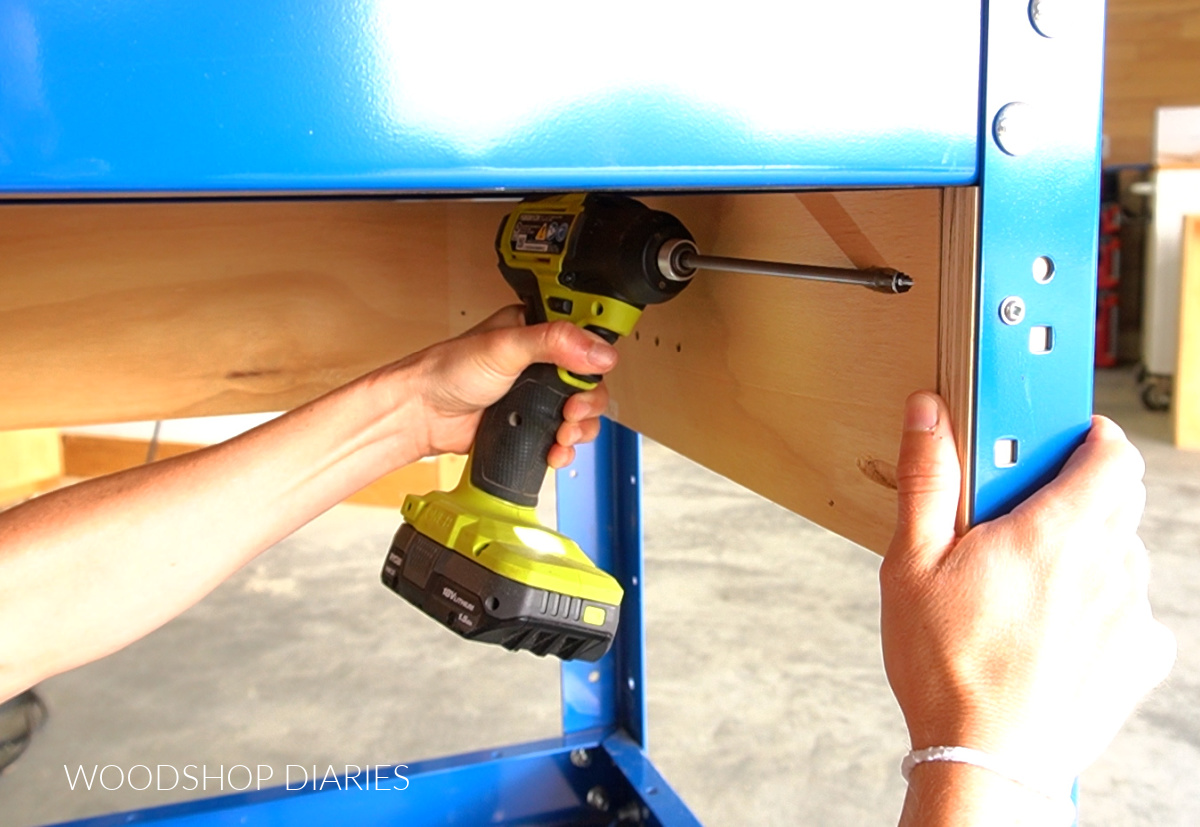 Installing drawer framing side panels into metal workbench