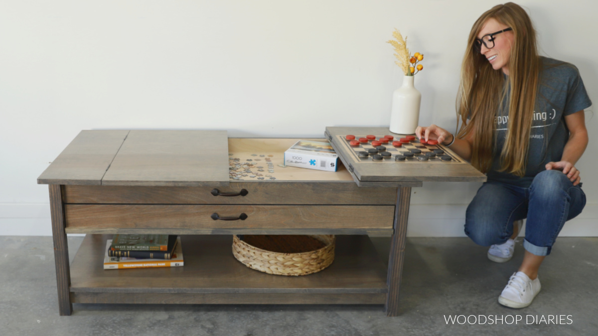 Shara Woodshop Diaries playing checkers on flip top of puzzle table