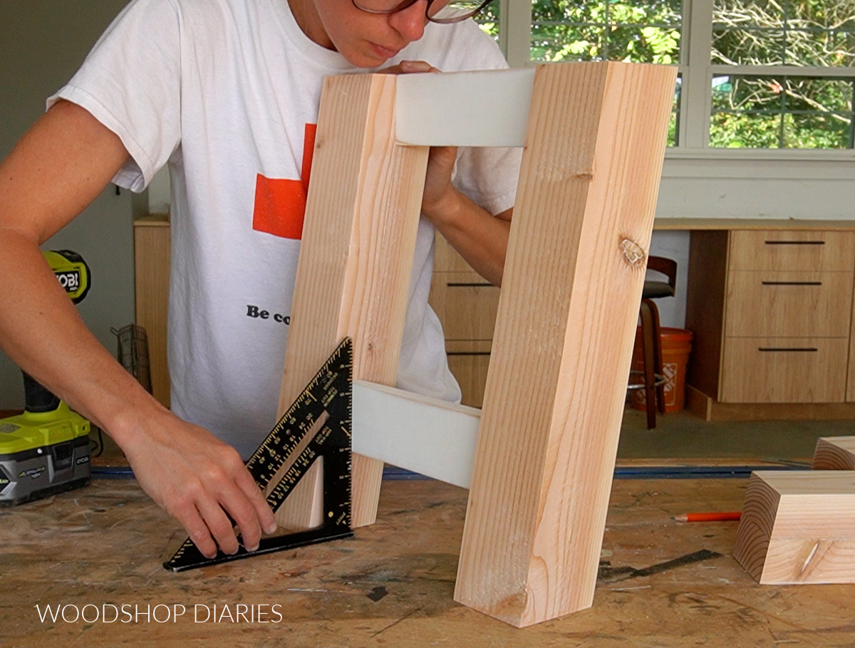 Shara Woodshop Diaries using a square to check board on shoe bench side