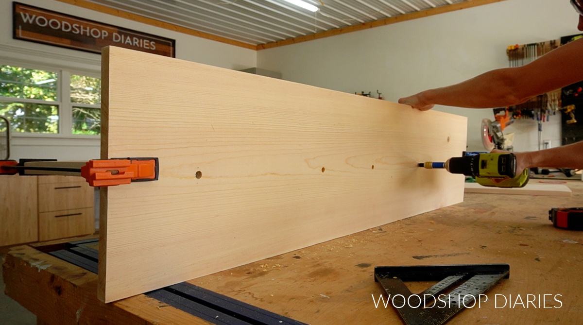 Securing divider panel to back panel using wood screws on back side