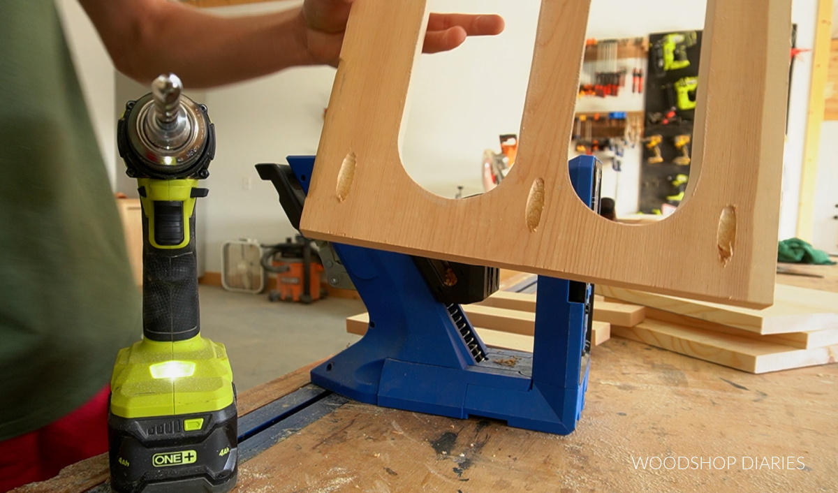 pocket holes drilled on slotted shelf board