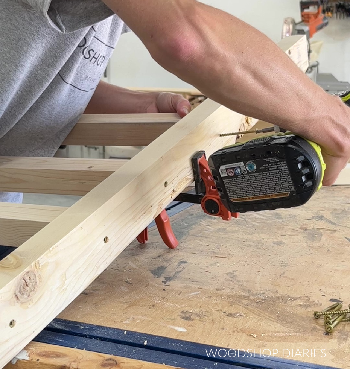 Shara Woodshop Diaries driving screws into boot rack posts