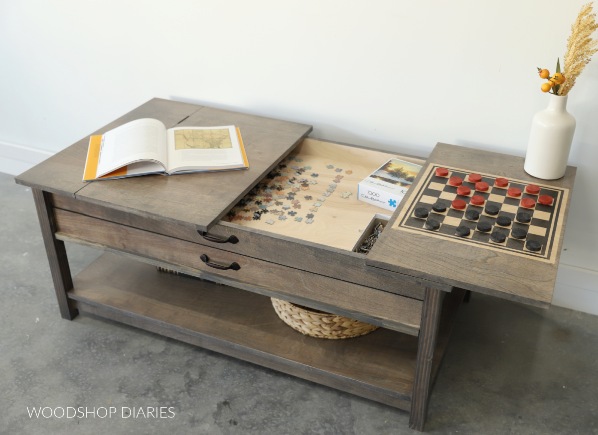 Gaming coffee table with puzzle compartment and checker board open