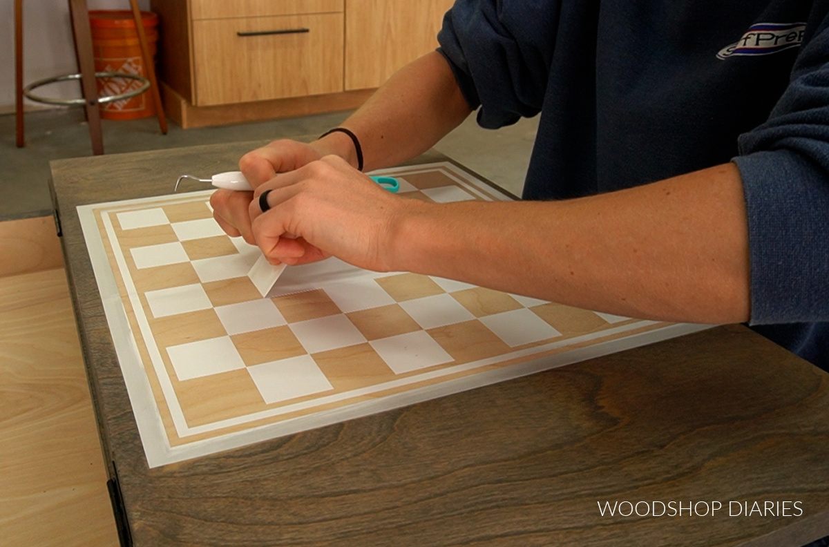 Shara Woodshop Diaries removing parts of stencil that need to be stained