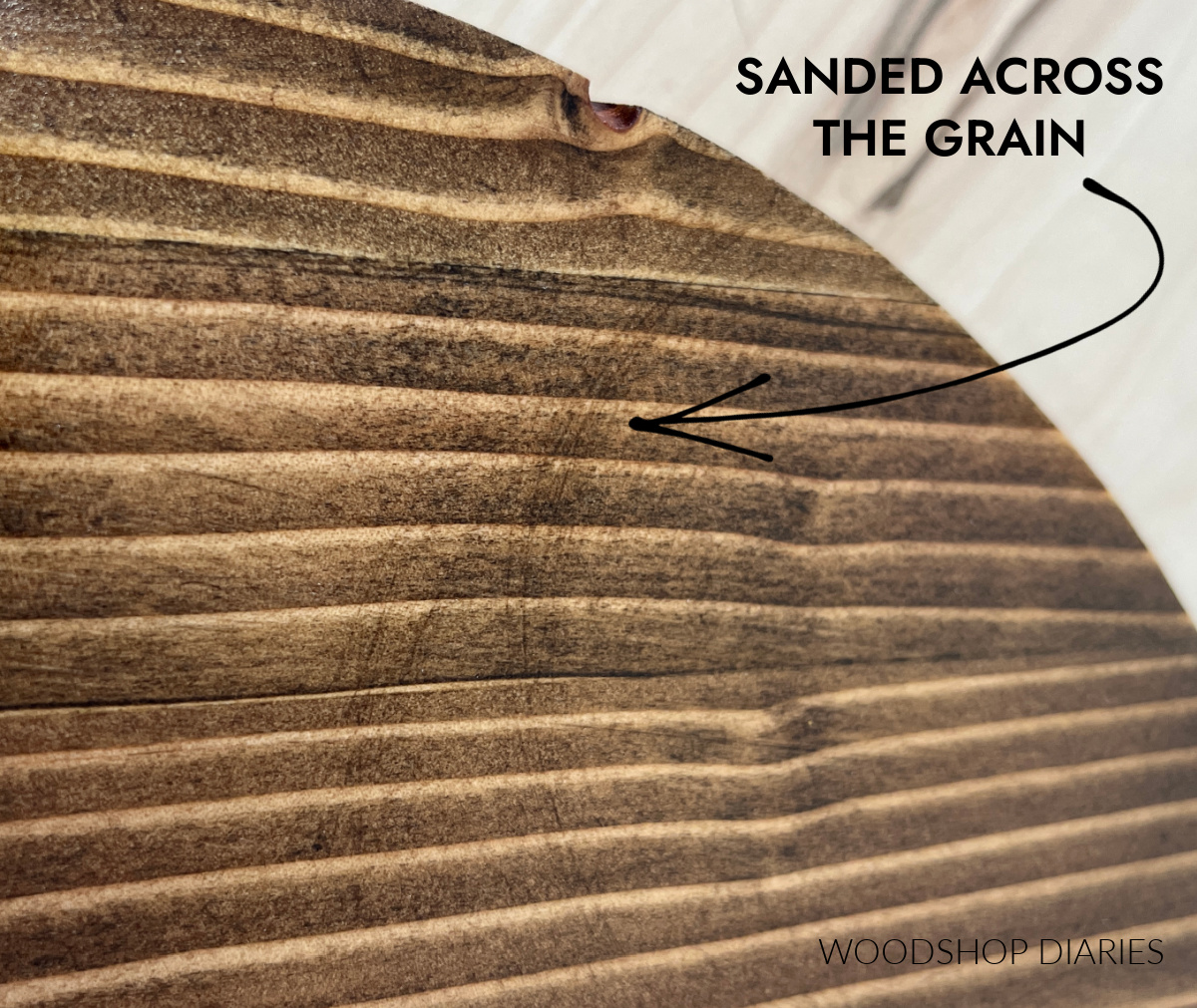 example showing across grain sanding marks on pine after stain