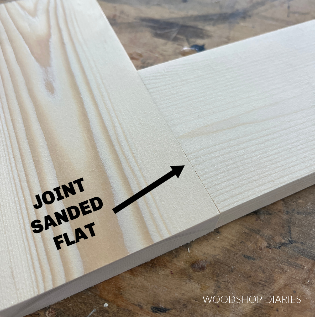 close up image showing a wood joint sanded smooth and flat