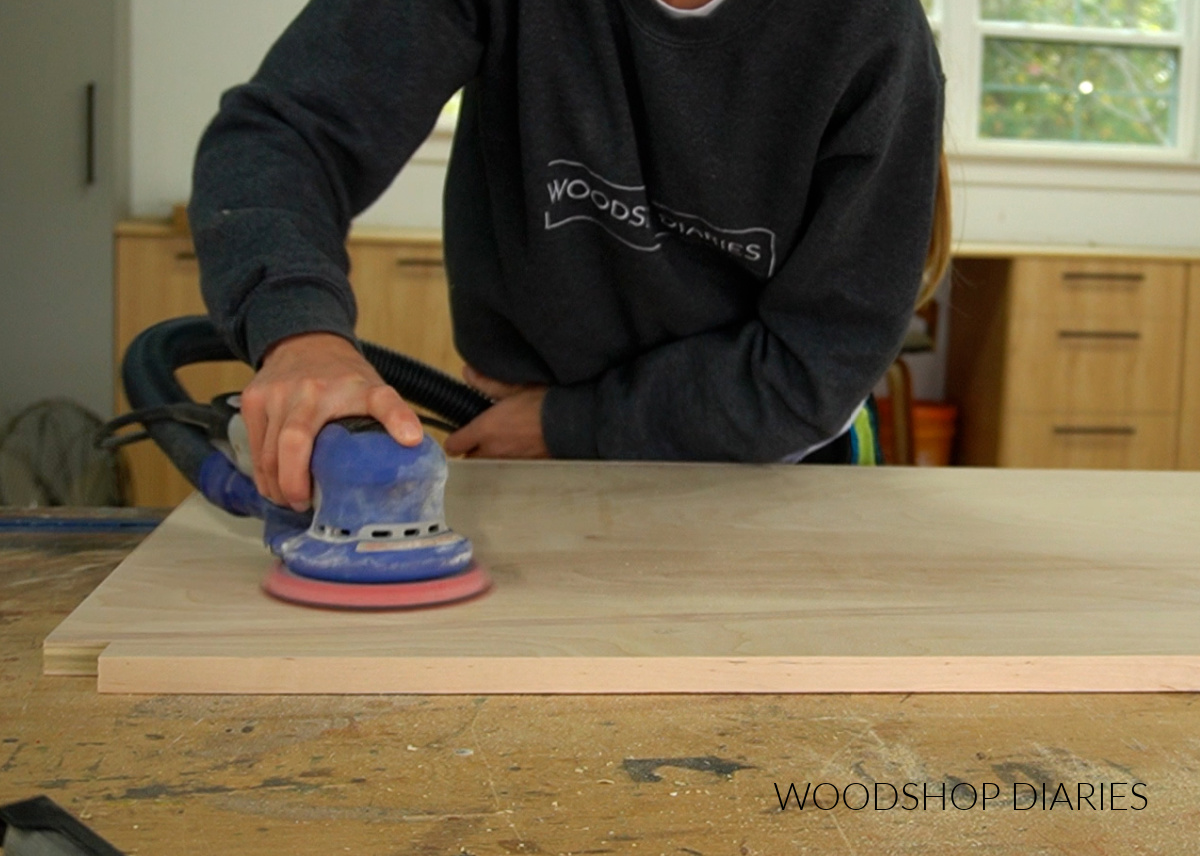 Shara Woodshop Diaries sanding plywood before painting