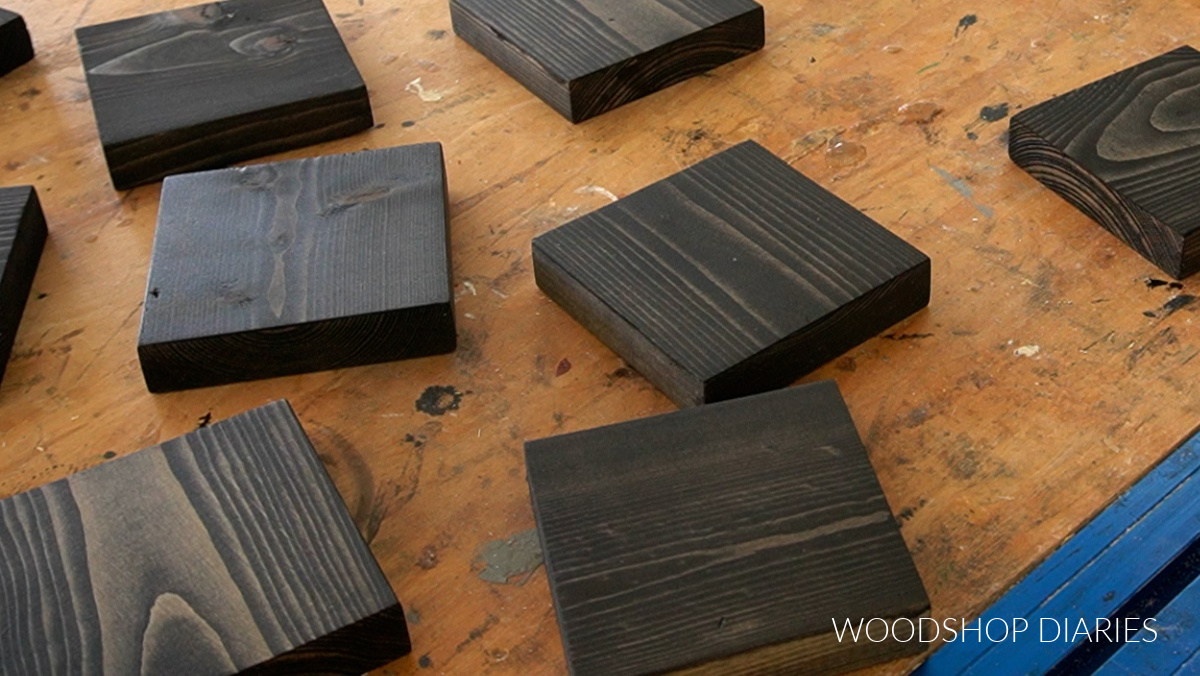 1x4 scrap squares stained black on workbench