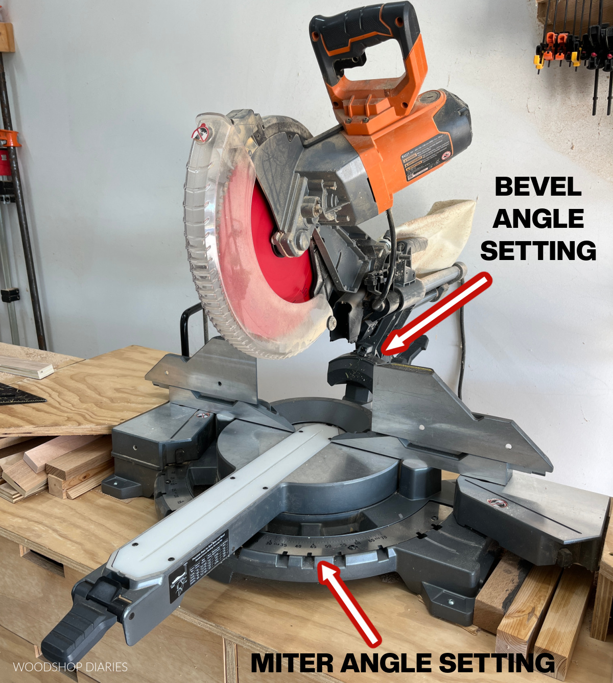 Miter saw with arrows pointing to miter and bevel adjustment settings
