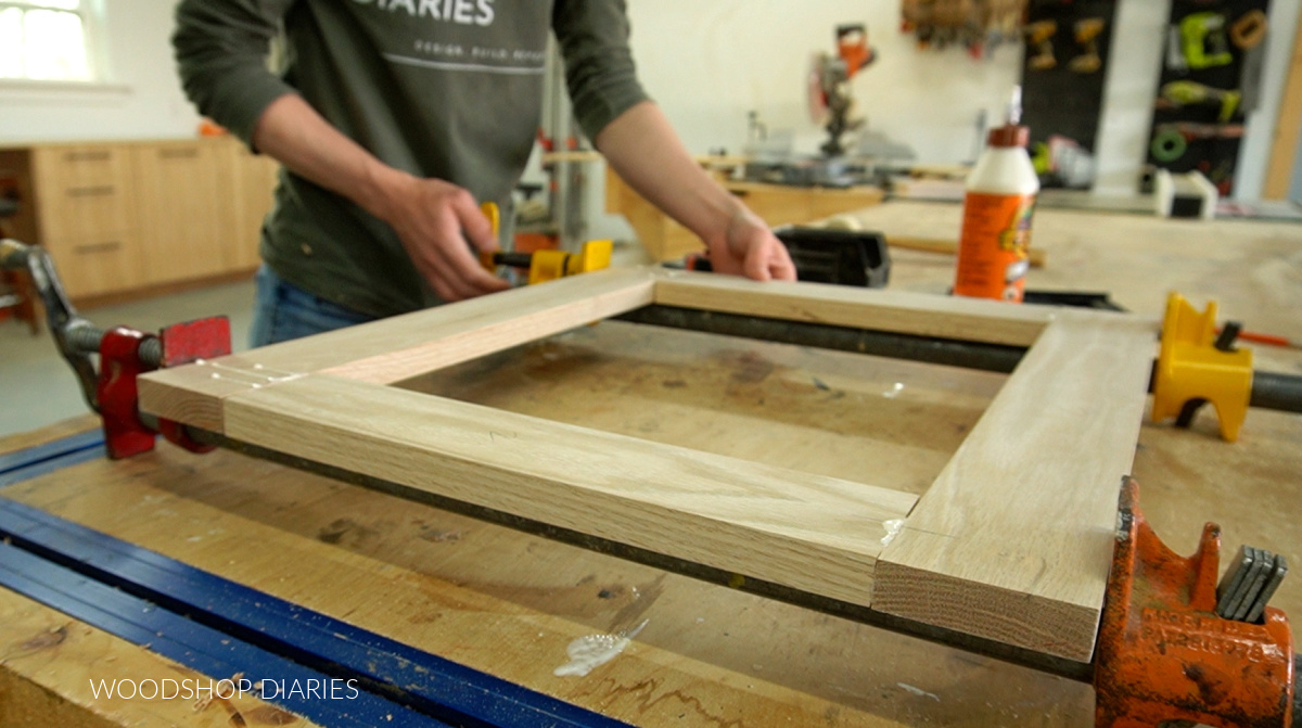 clamping door frame on workbench after assembled using dowels