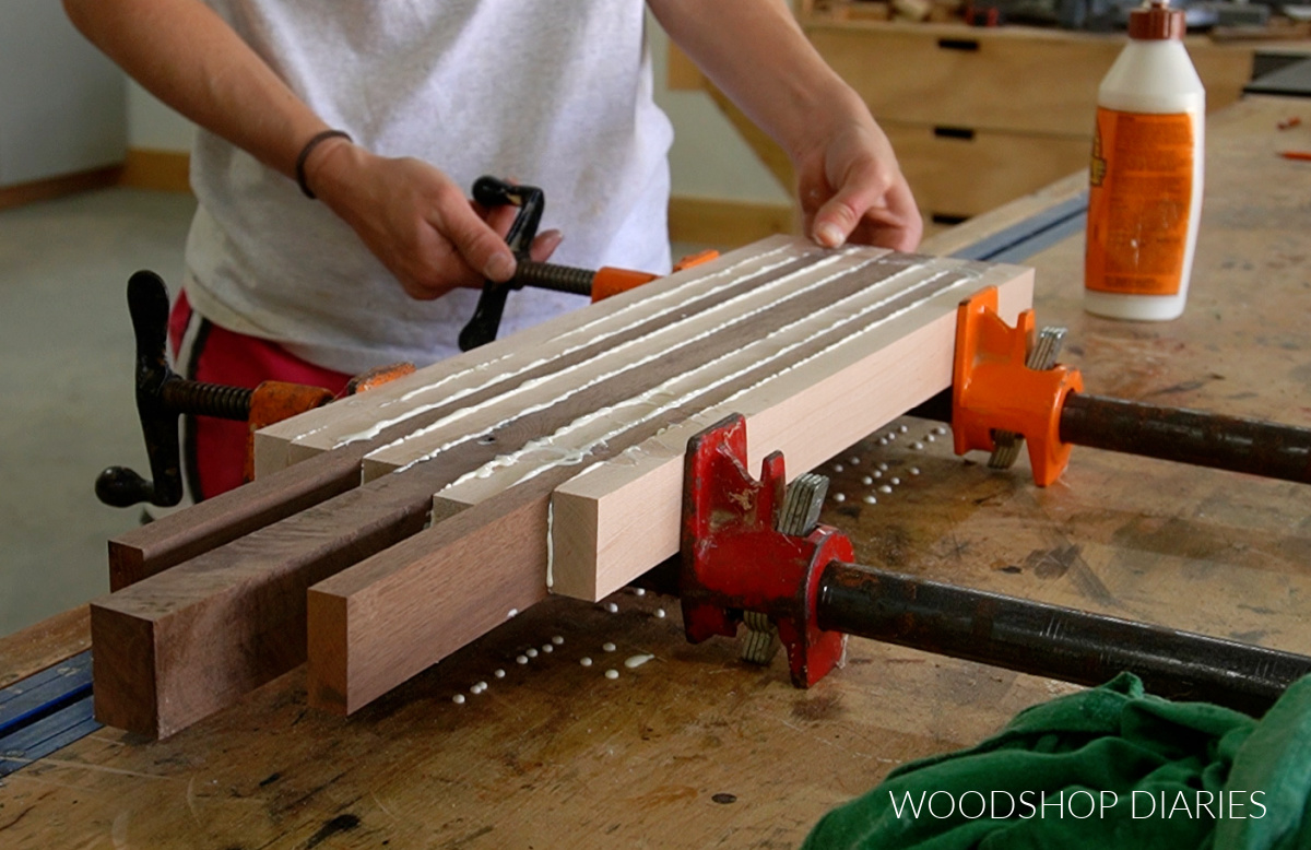 Gluing up the other half of cutting board pieces in pipe clamps