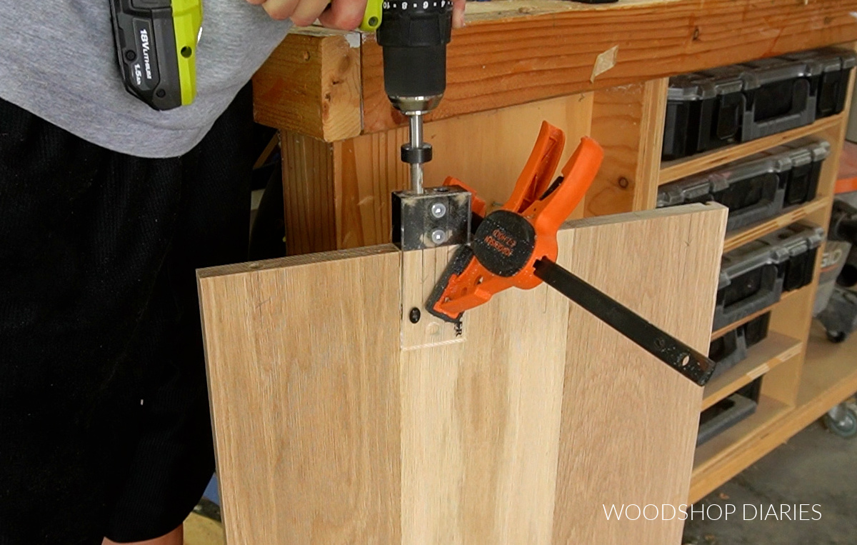 Drilling dowel holes into end of wood panel using dowel jig