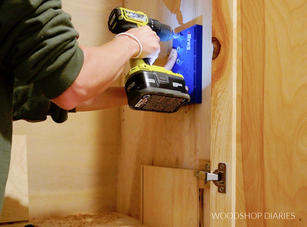 Shara Woodshop Diaries drilling shelf pin holes into built in cabinet