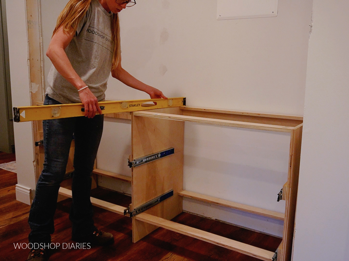 Shara Woodshop Diaries installing drawer cabinet into closet opening