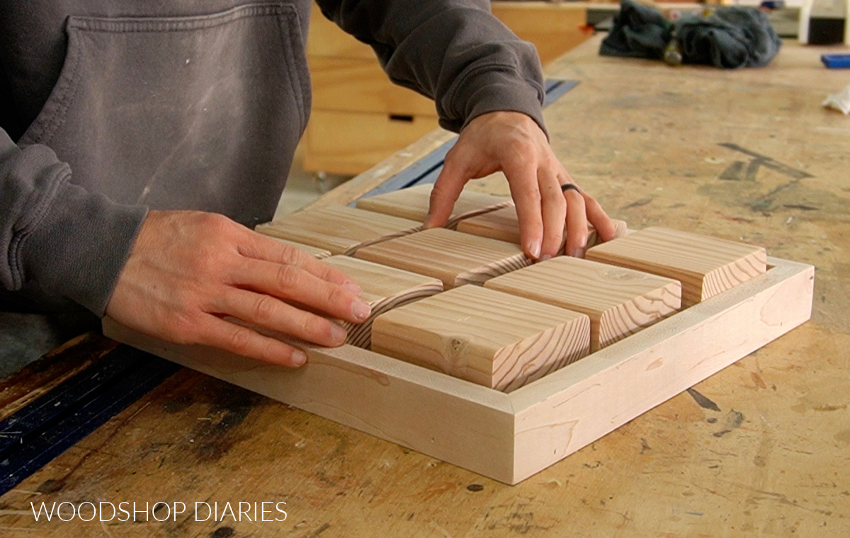 Placing 2x4 blocks inside tic tac toe tray