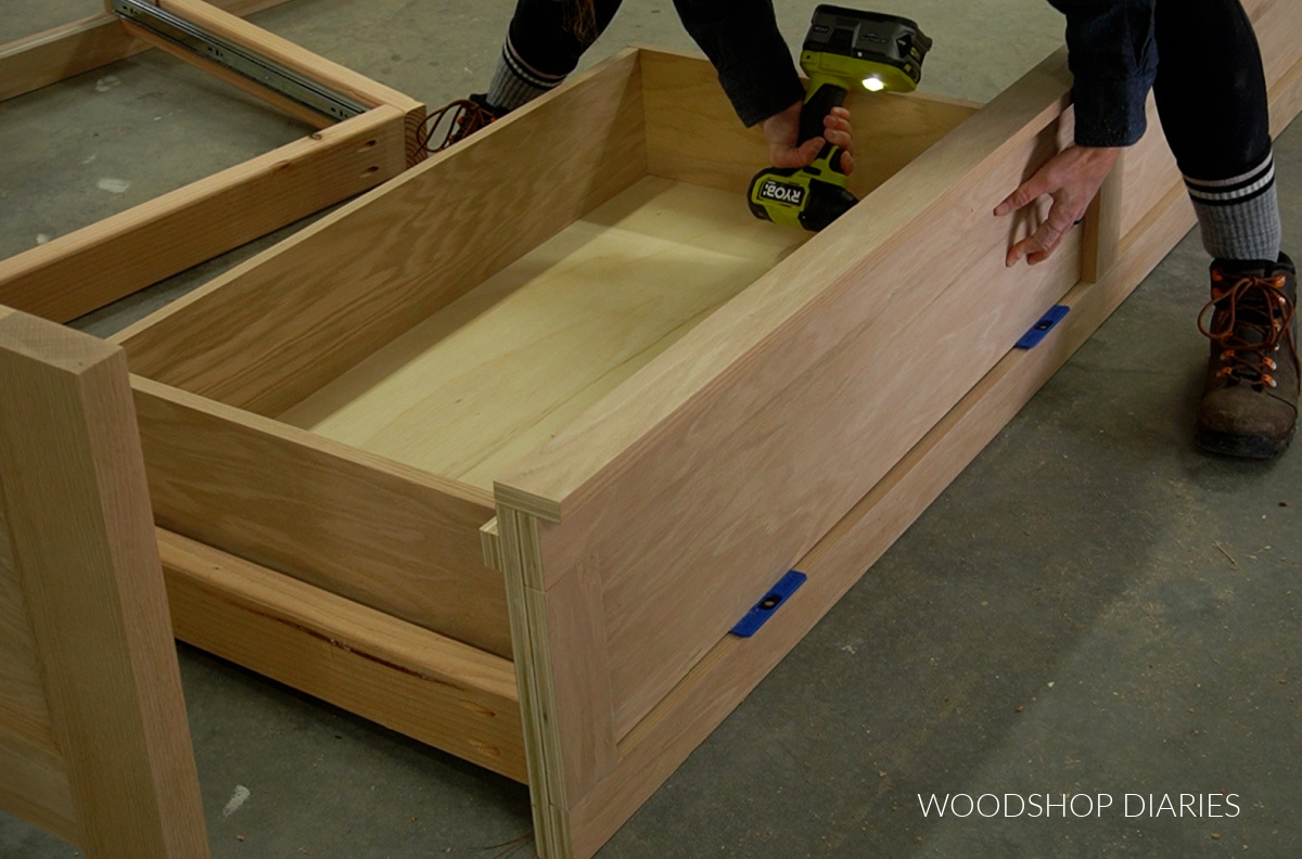 Shara Woodshop Diaries installing drawer front onto drawer box in storage bed side rails