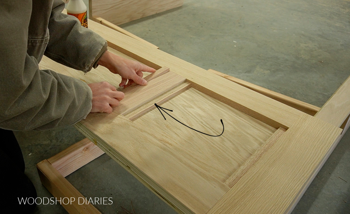 Shara Woodshop Diaries installing trim pieces on footboard of bed with drawers