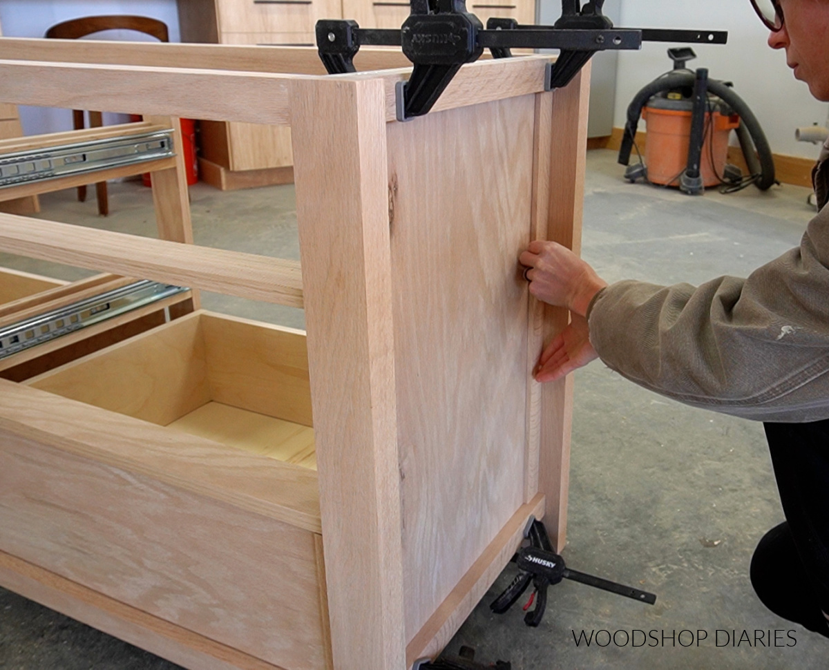 Shara Woodshop Diaries gluing trim around dresser side panel