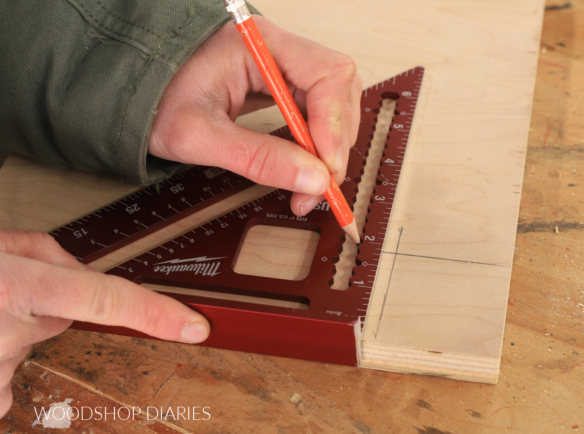 Using a square to mark 2" notch on plywood corner