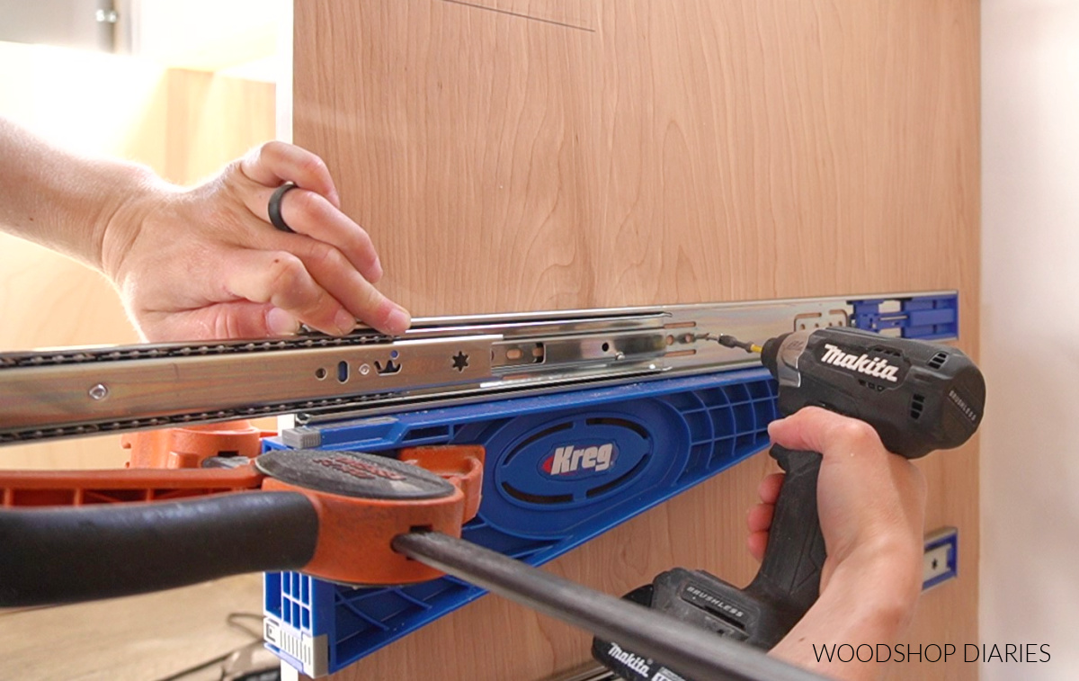 Driving screws to install drawer slide using Kreg drawer slide jig