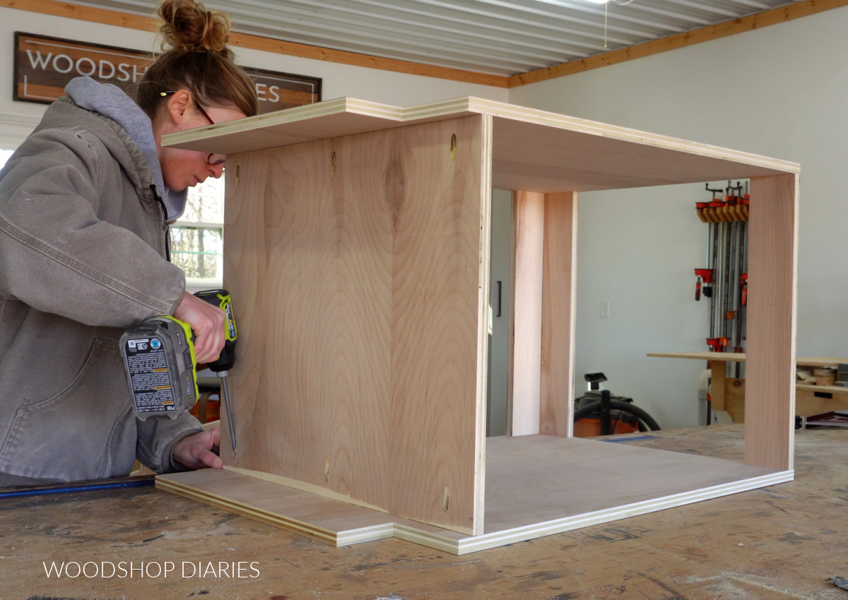 Shara Woodshop Diaries assembling base cabinet box on workbench using pocket holes and screws