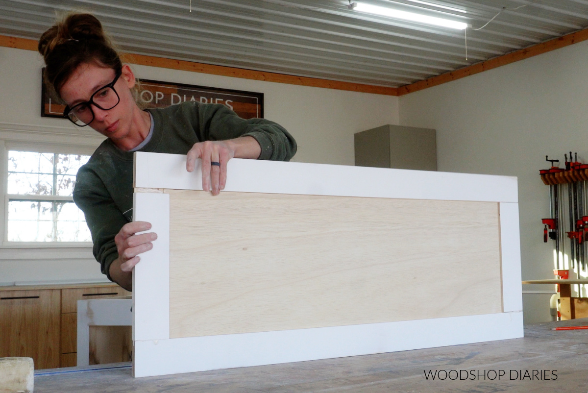 Shara Woodshop Diaries assembling cabinet door on workbench