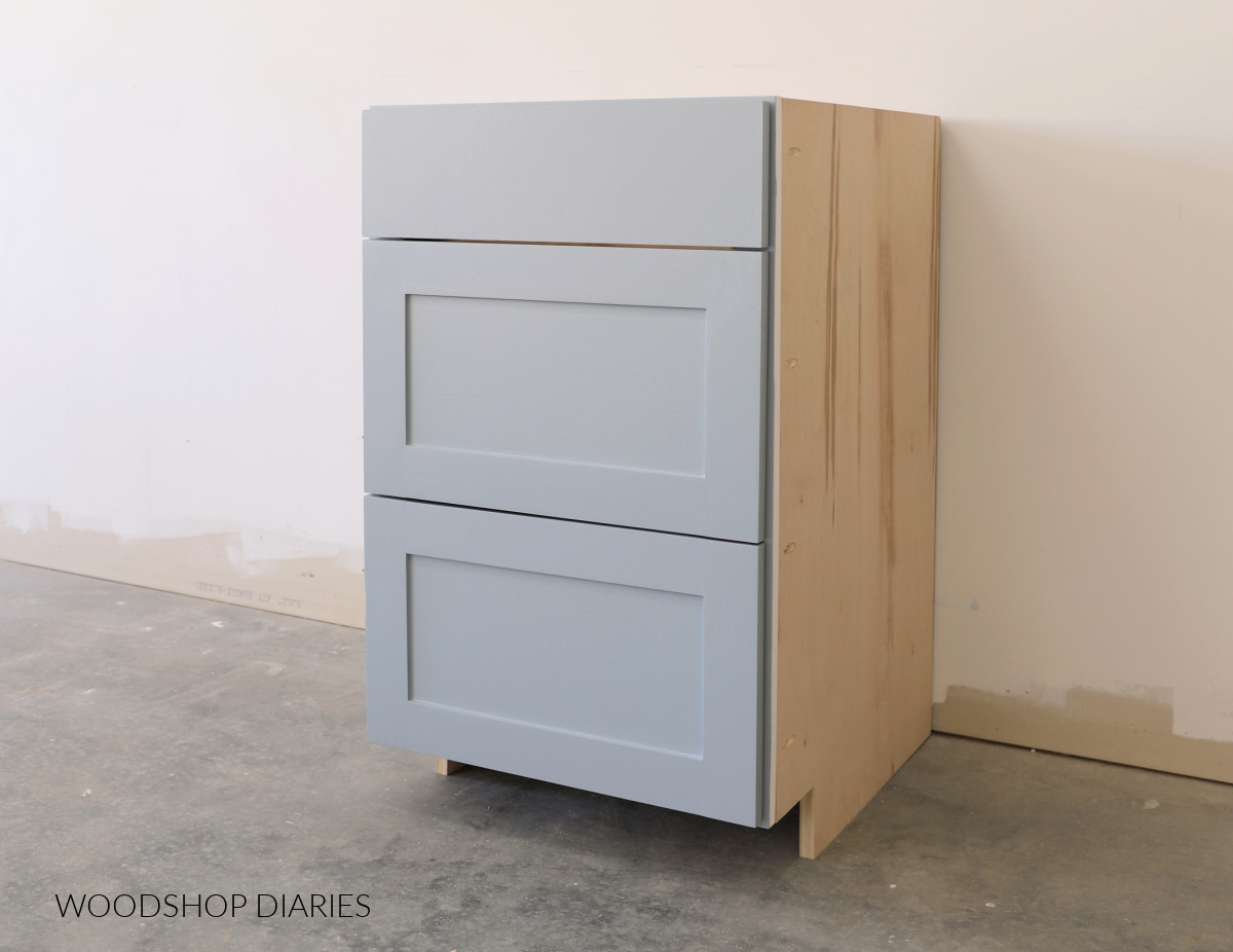 Base cabinet with two deep drawer boxes and one top shallow drawer box
