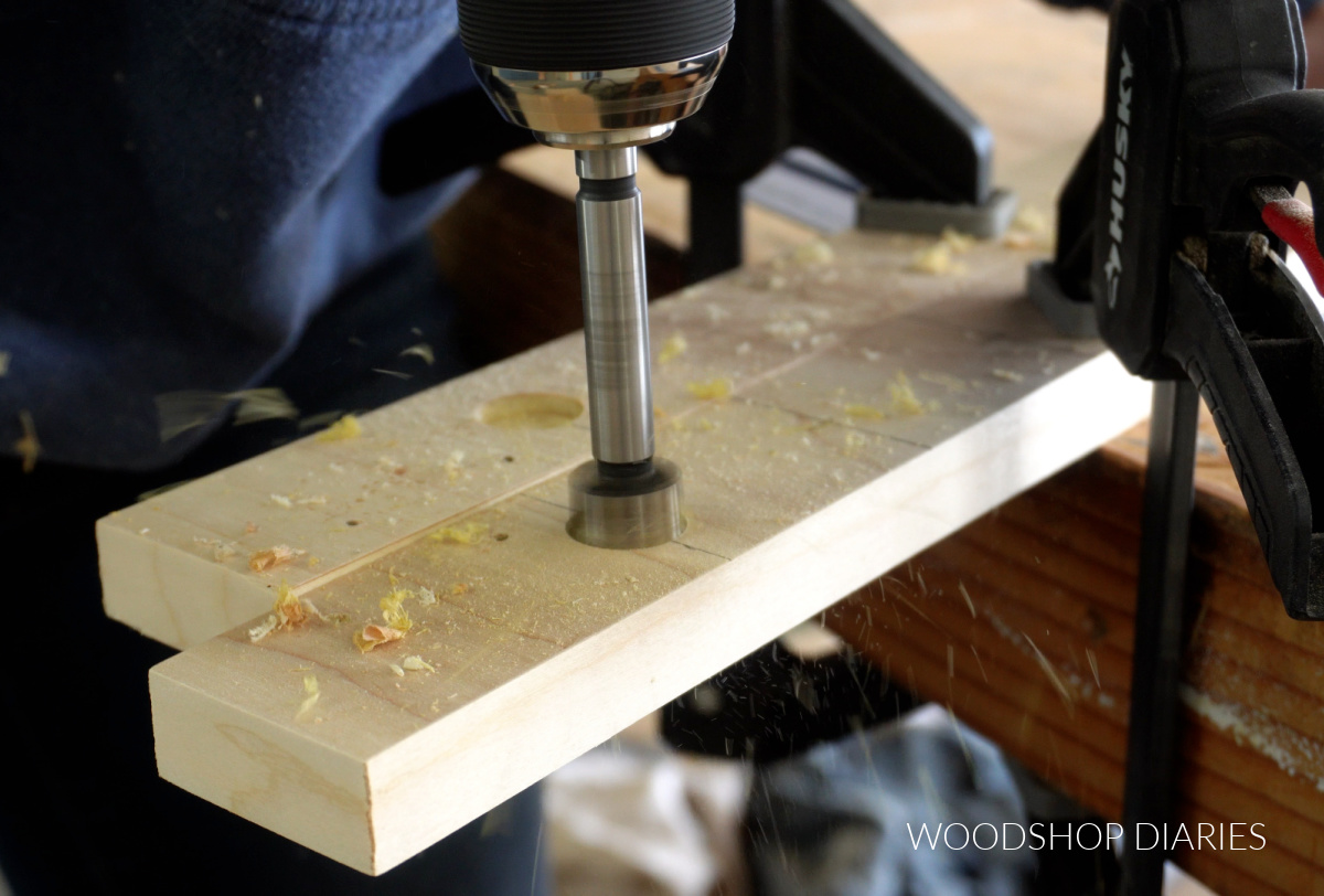 Close up of Forstner bit drilling holes in sides of drying rack