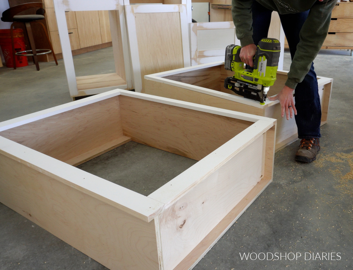 Shara Woodshop Diaries nailing face frame onto front of cabinets