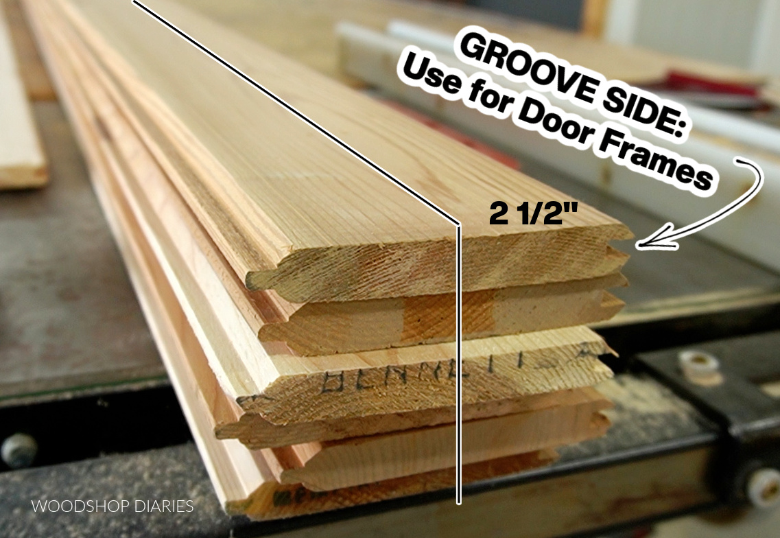 Tongue and groove lumber stacked on table saw with line drawn down middle showing 2 ½" on groove side of board with text "groove side use for door frames"