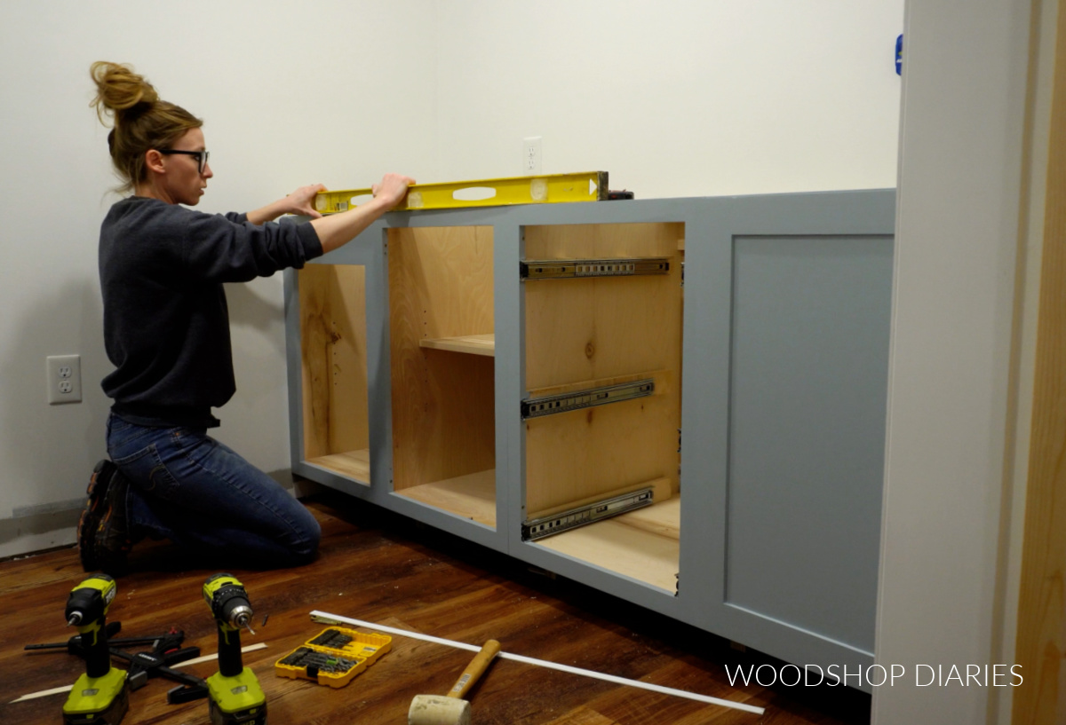 Shara Woodshop Diaries installing base cabinets in laundry room