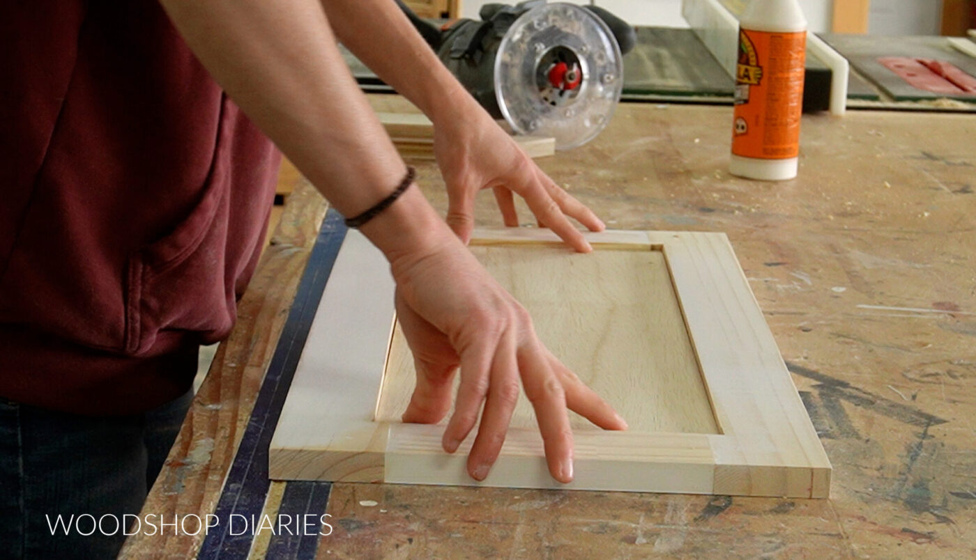 Shara Woodshop Diaries assembling cabinet door on workbench
