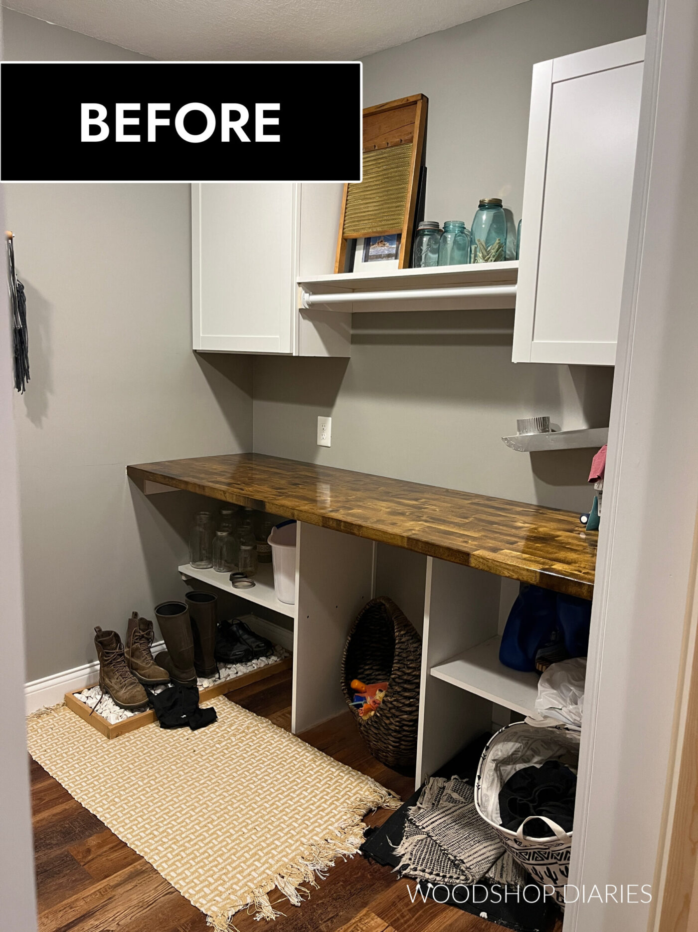 Laundry room before right side wall cabinets and shelving