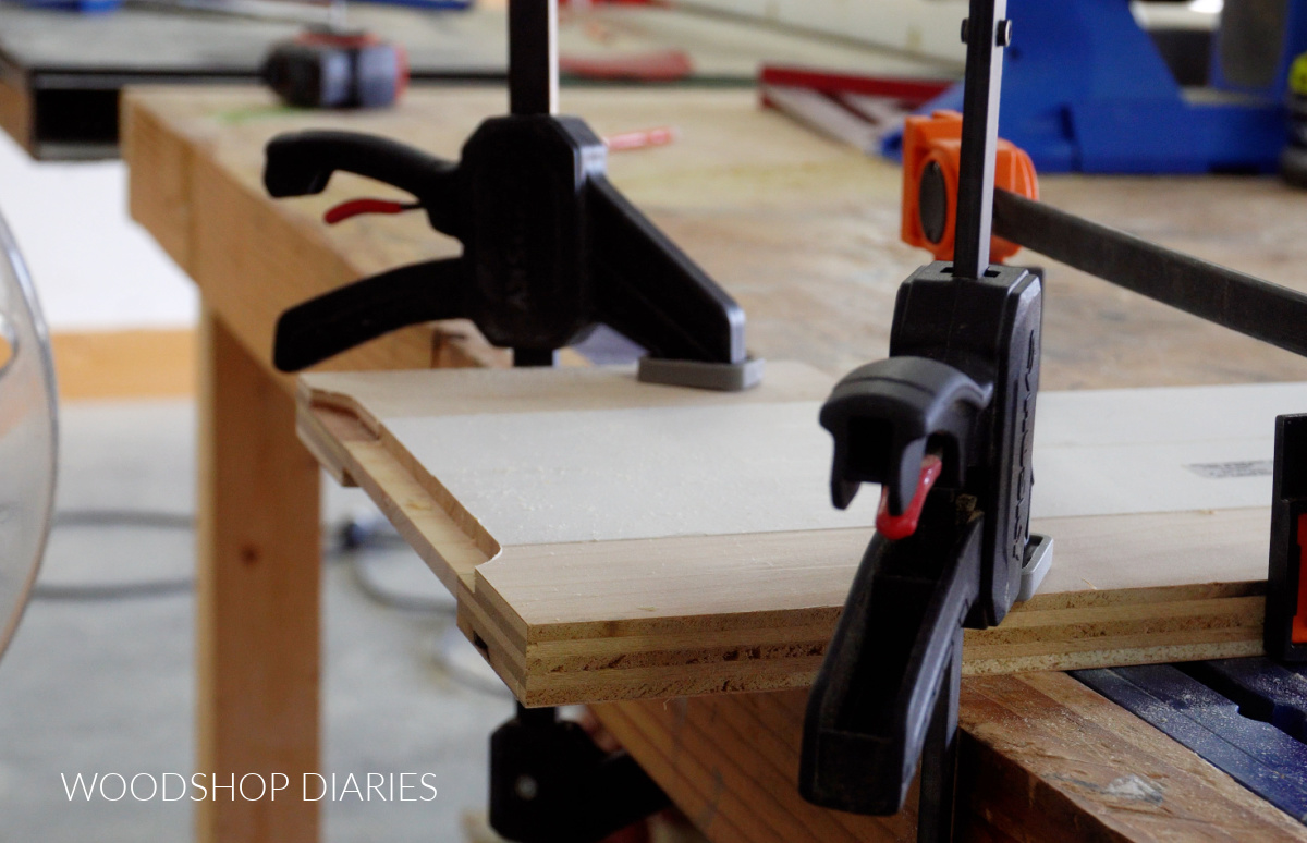 rails clamped to workbench with routed ends to create tongue