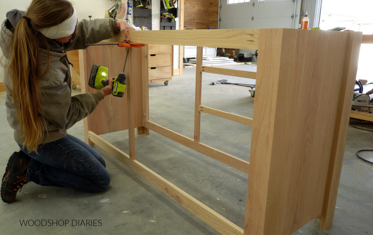 Shara Woodshop Diaries building bathroom vanity frame--securing divider piece on back side