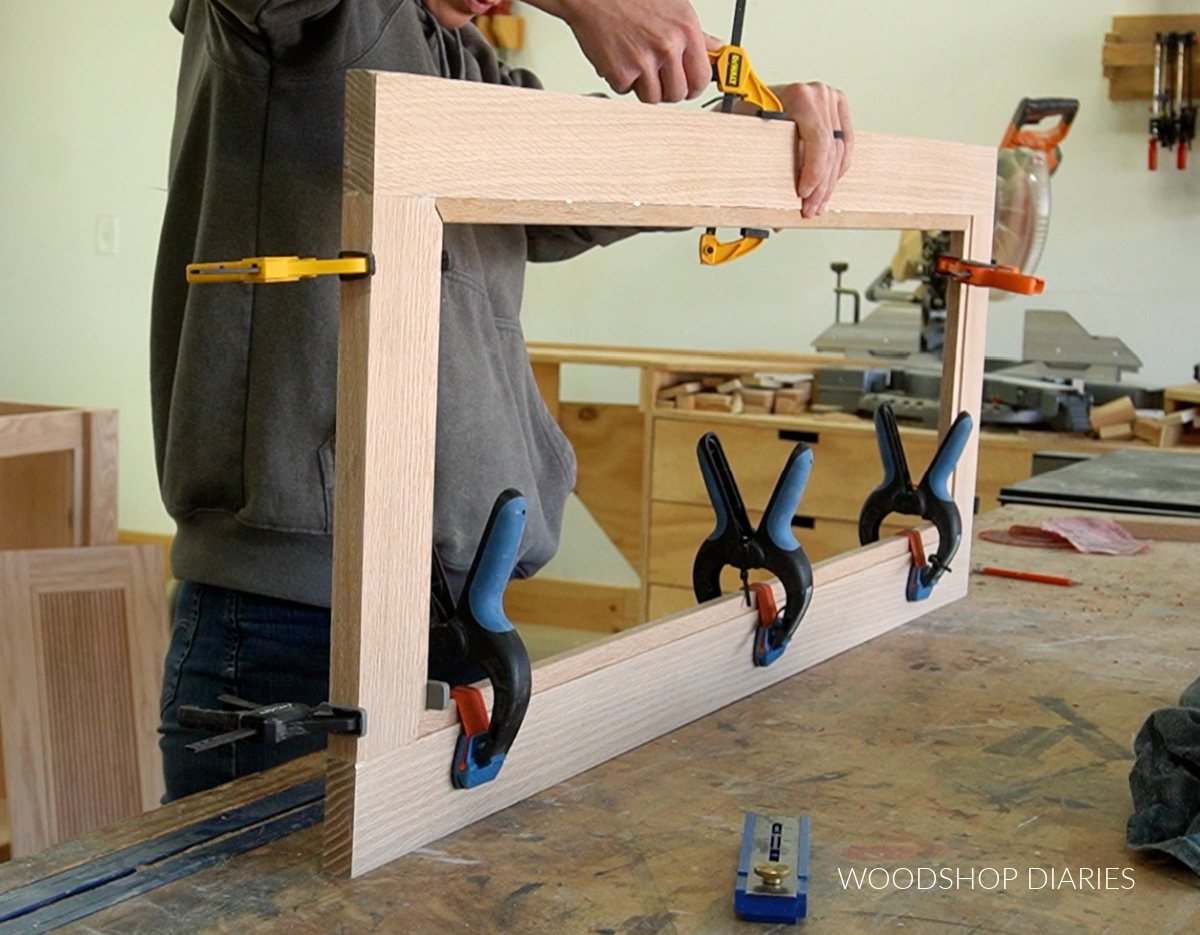 Shara Woodshop Diaries clamping dowels around inside of door frame