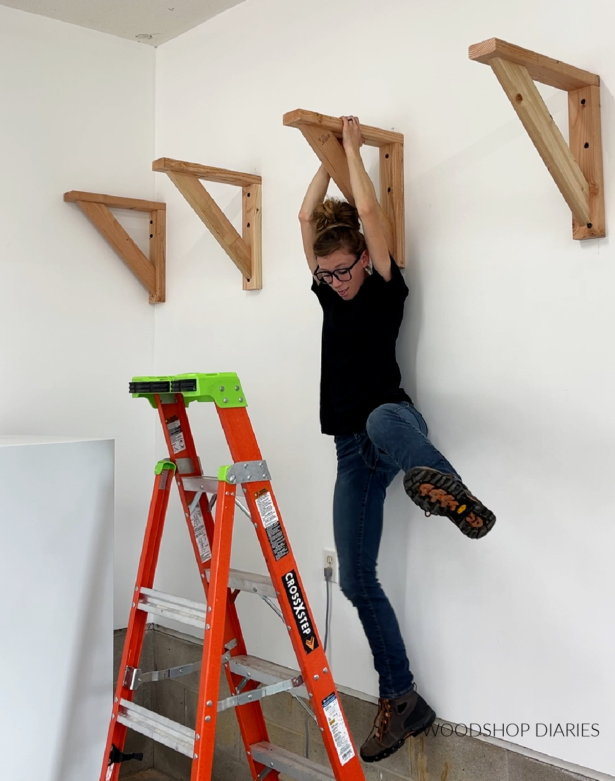 Shara Woodshop Diaries hanging from garage wall shelf support