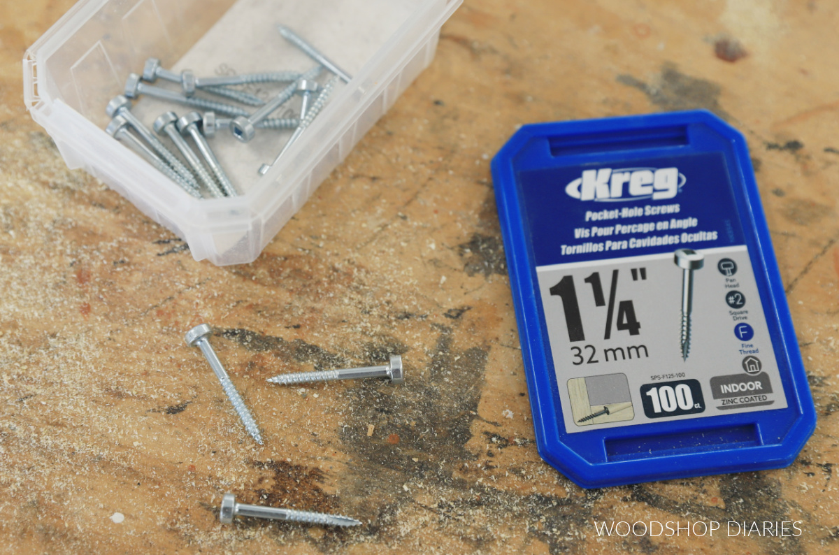 1 ¼" pan head pocket hole screws container on workbench with screws laid out around it