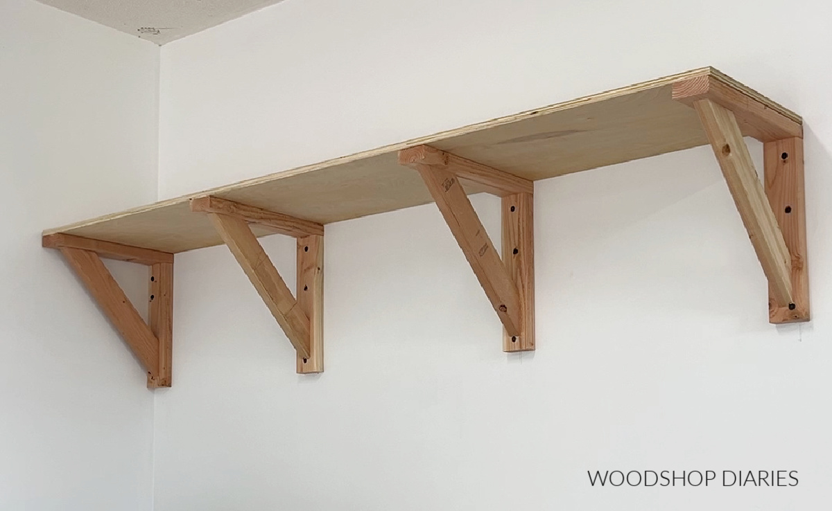 Garage wall shelf installed--2x4 bracing supports with plywood panel on top